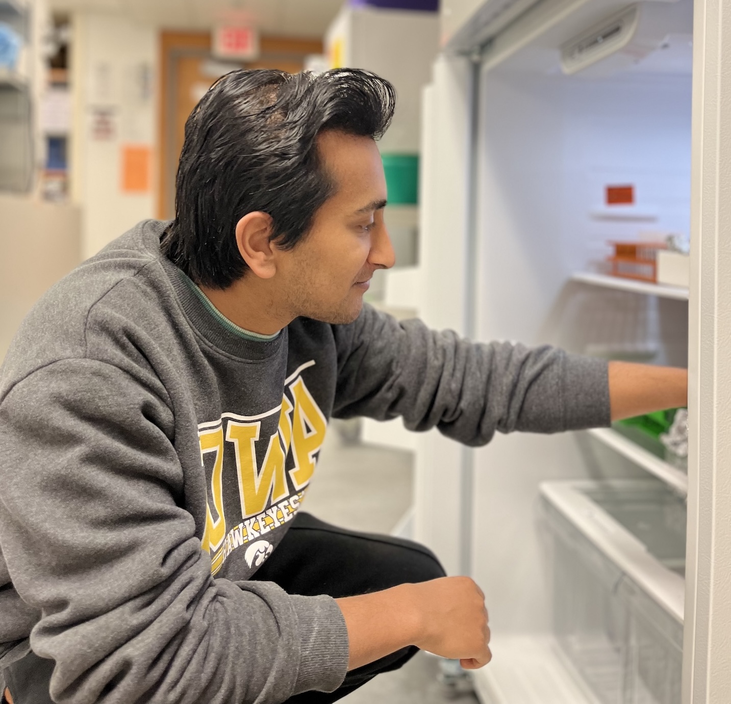 Mohan looking in a refrigerator