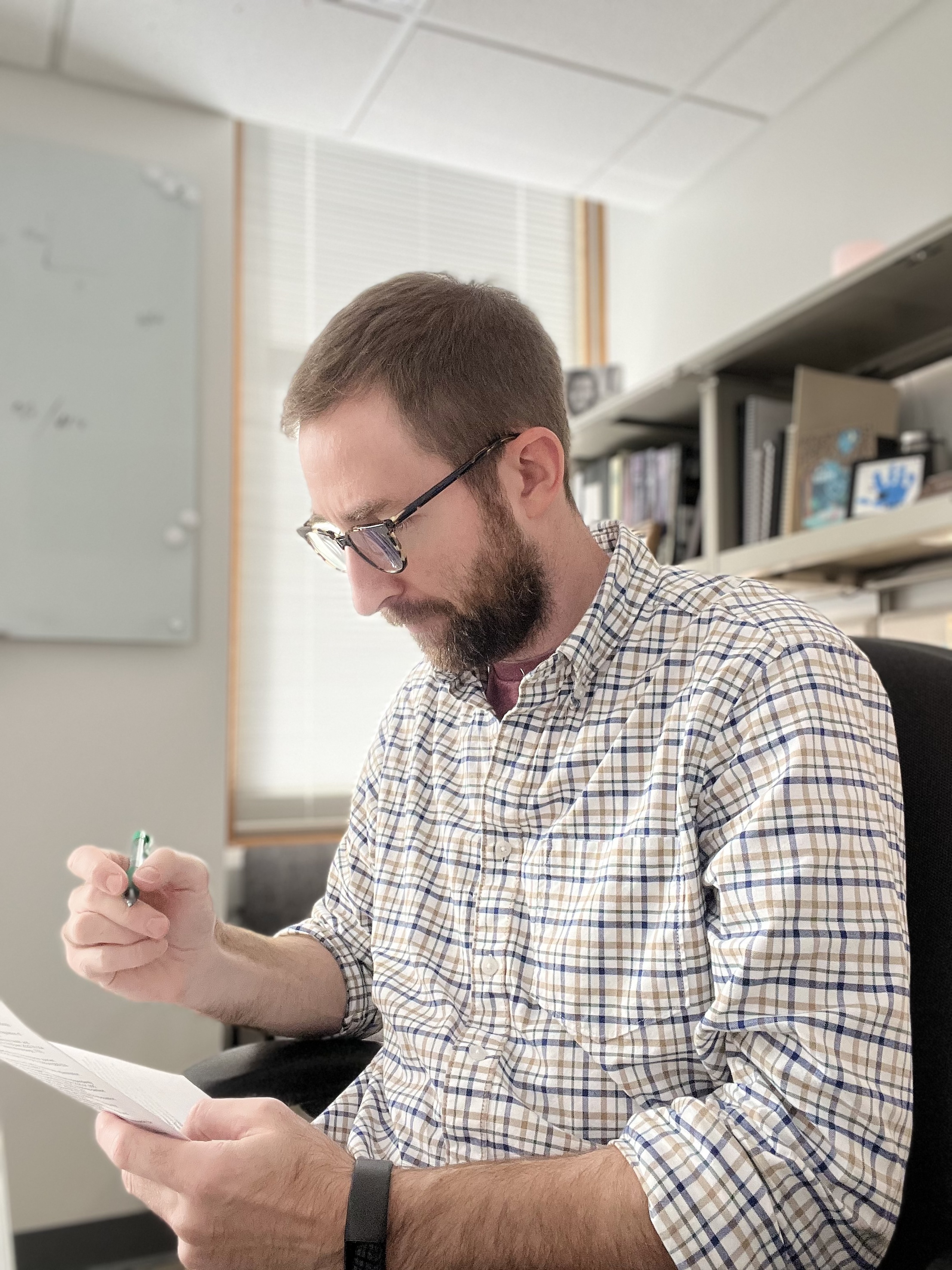 Alex reviewing notes